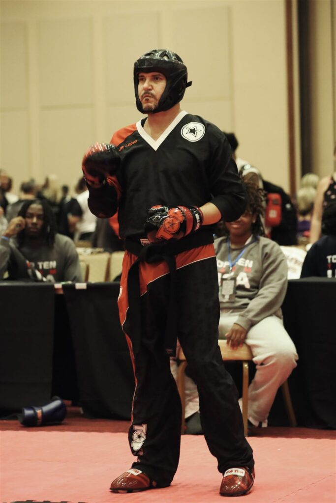 JR Lopez standing ready on the mat at a tournament